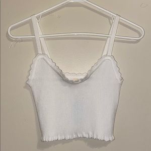 Very stretchy white tank top. NEW WITH TAGS!